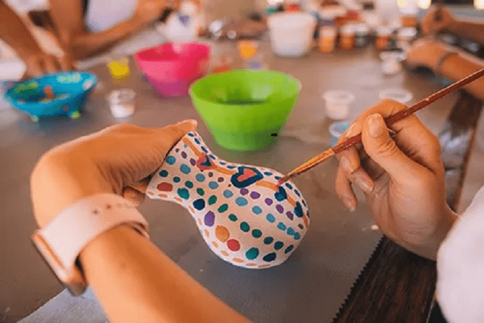 Kids creating Mayan pottery